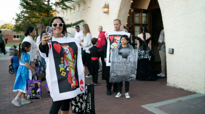 Families arrive at the Halloween Party
