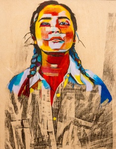 painting of girl with red and yellow face, blue braided hair, and a black and cream shirt